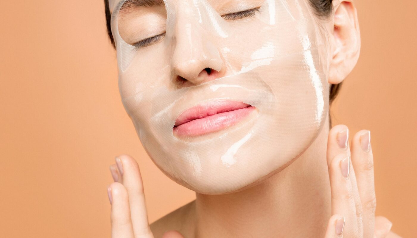 Woman enjoying a rejuvenating face mask treatment, promoting skin health and relaxation.